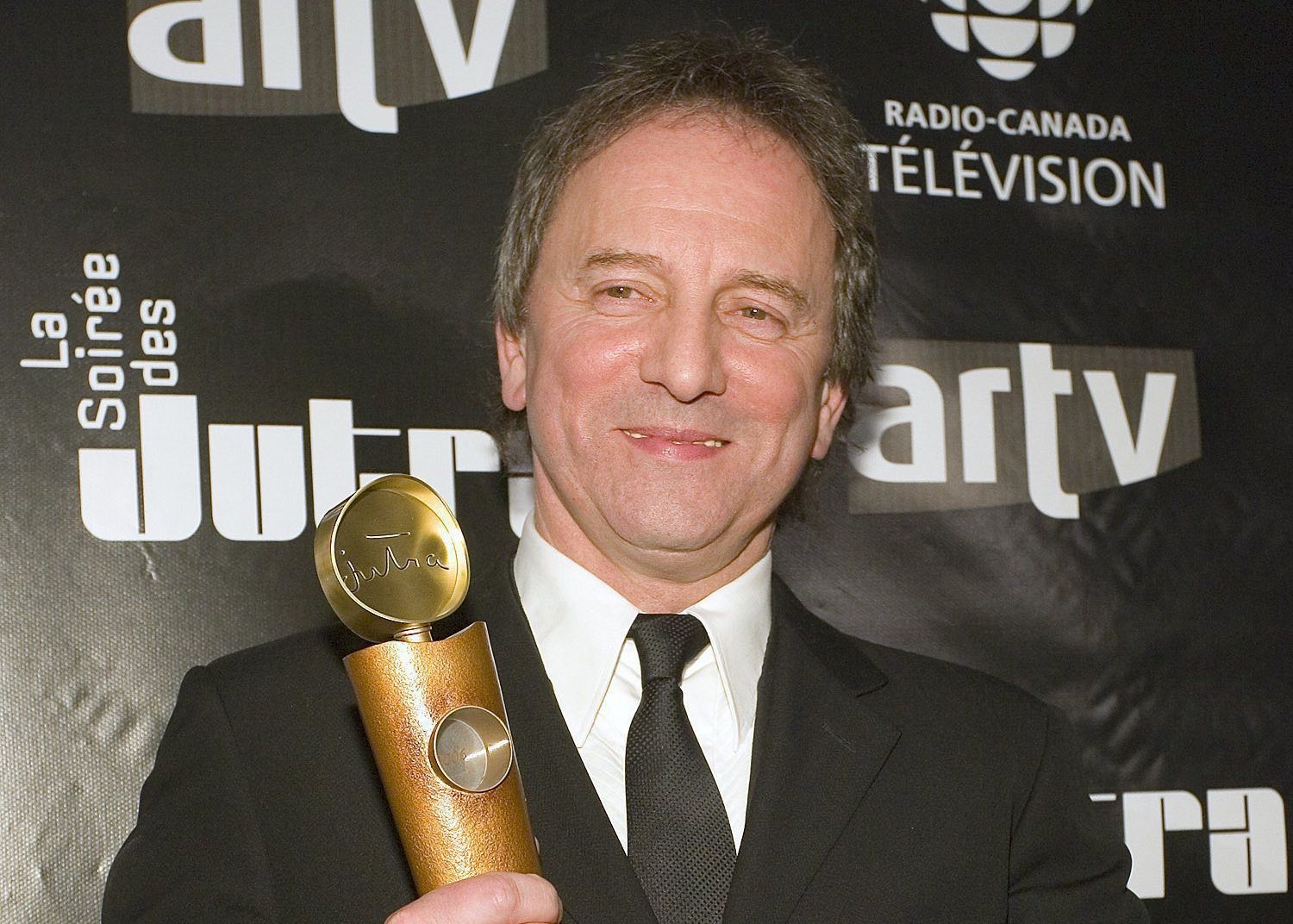 Michel Cote poses backstage after winning Best supporting actor in a male role in "C.R.A.Z.Y." at the 2006 Jutras Awards. Sunday March 19, 2006 in Montreal. (CP PHOTO/David Boily)