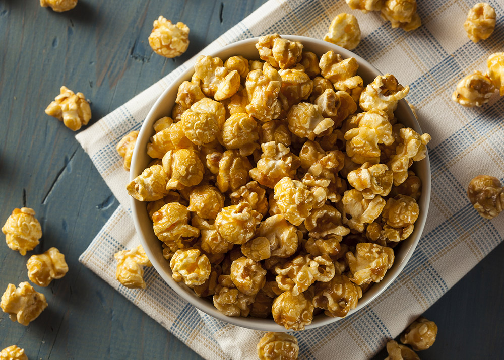 Homemade Golden Caramel Popcorn in a Bowl