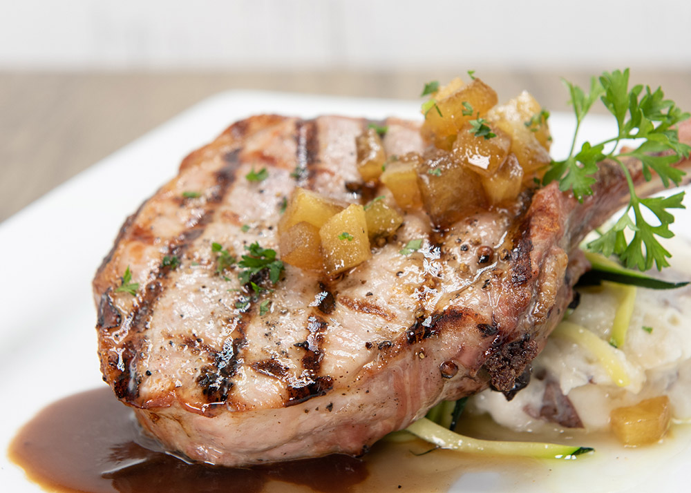 Grilled pork chop served with mash potatoes and pasta to indulge that hearty appetite.