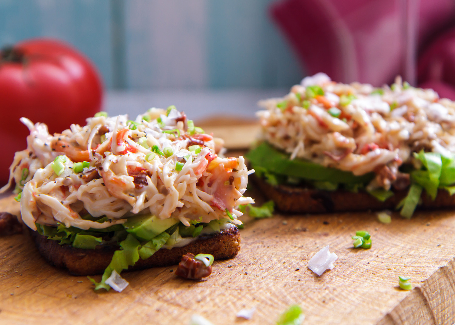 Bruschetta with crab salad served on wooden board horizontal