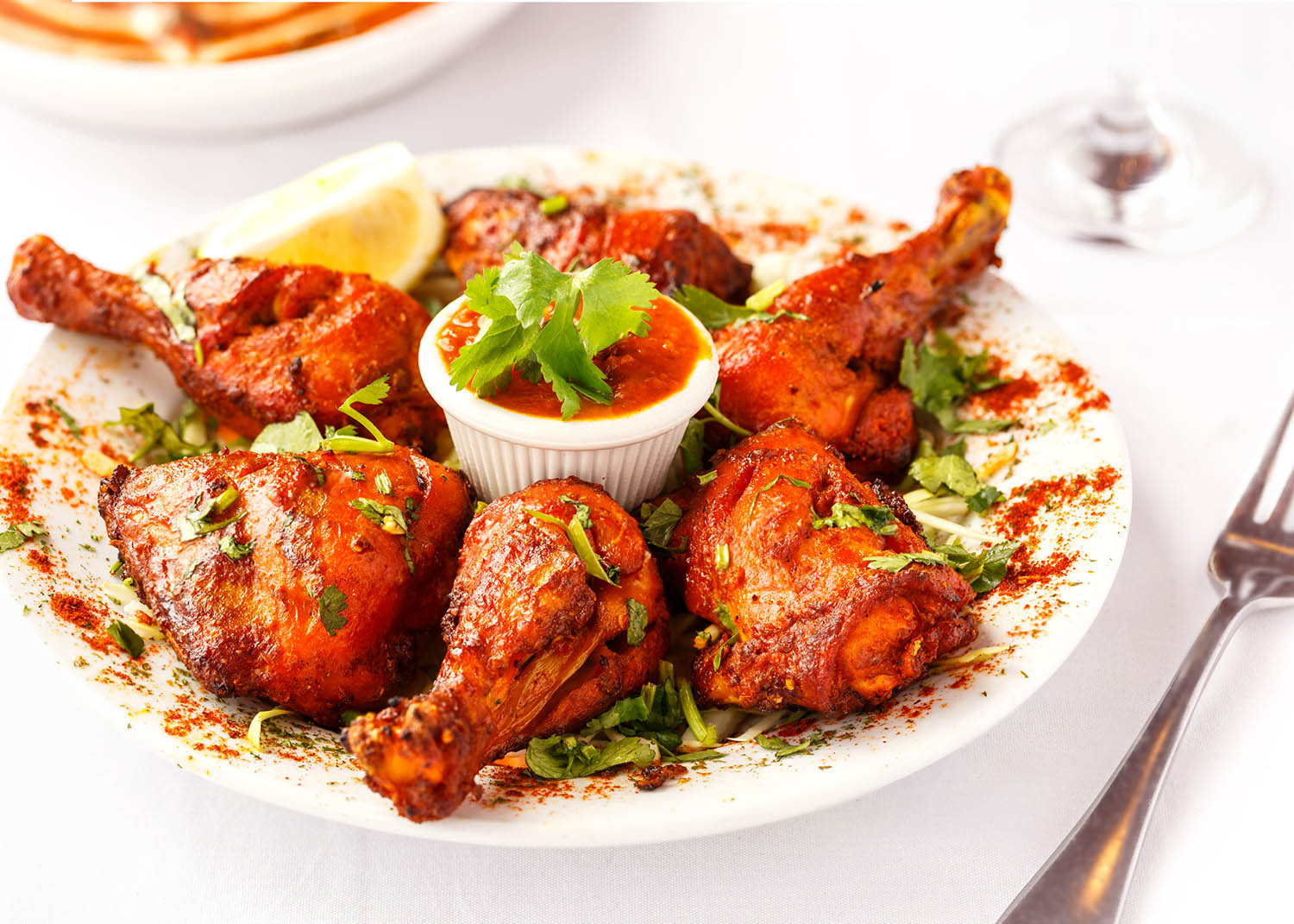 Indian Food Entree of Tandoori Chicken with Herbs on top