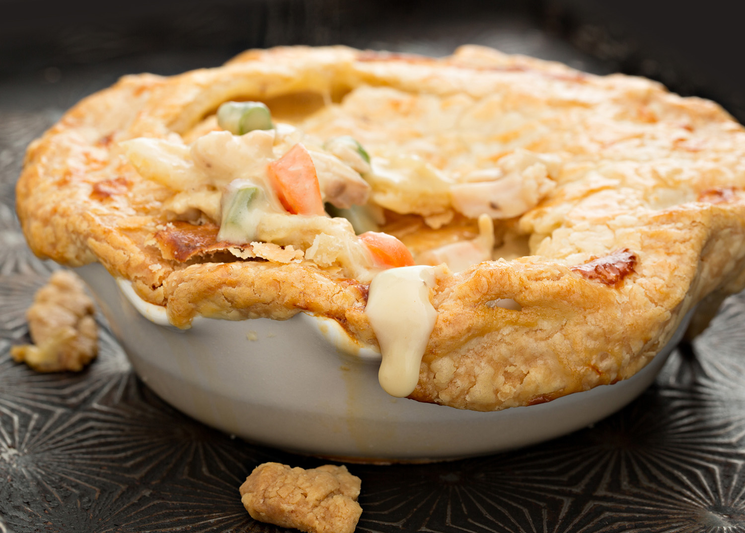 A high angle close up who of a freshly baked individual turkey pot pie.