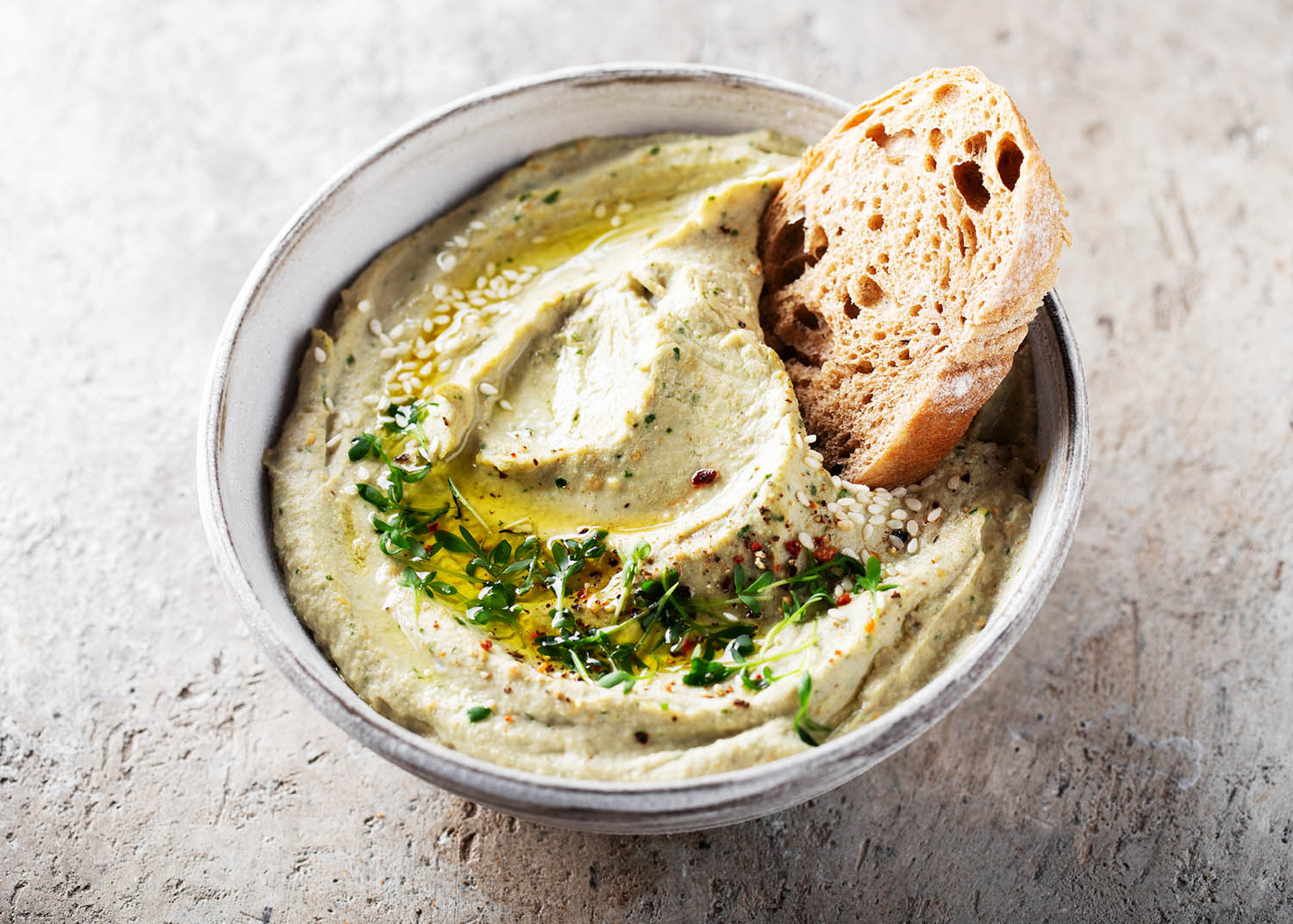 Baba ghanoush, babaganoush or eggplant hummus on the bowl with bread, traditional Middle Eastern cuisine