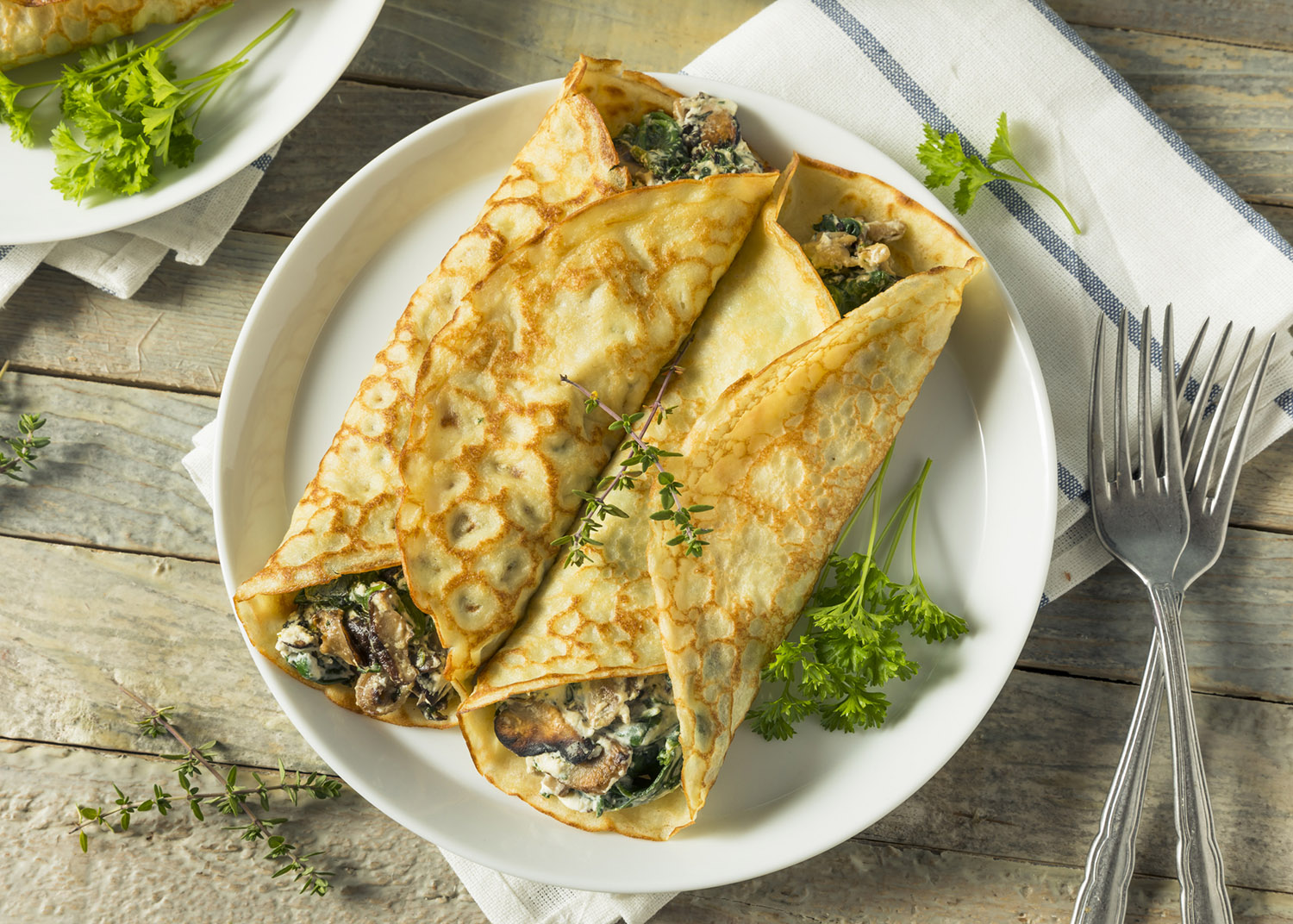 Savory Homemade Mushroom and Spinach Crepes with Cheese