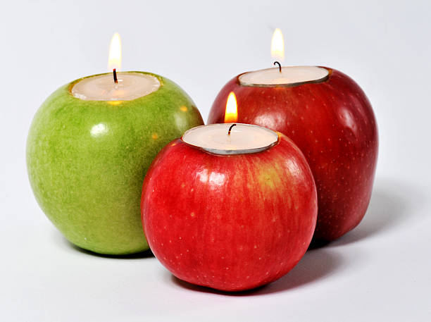 candle and apple isolated background