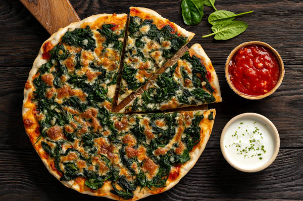 Homemade spinach pizza with mozzarella.