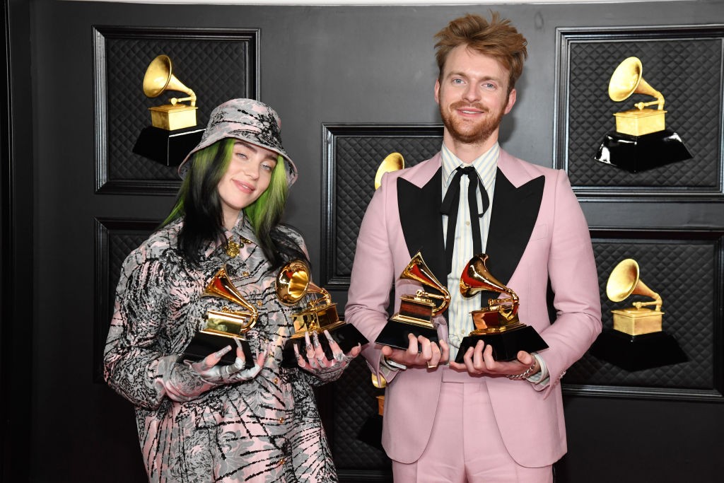 LOS ANGELES, CALIFORNIA - MARCH 14: (L-R) Billie Eilish and FINNEAS, winners of Record of the Year for 'Everything I Wanted' and Best Song Written For Visual Media for "No Time To Die", pose in the media room during the 63rd Annual GRAMMY Awards at Los Angeles Convention Center on March 14, 2021 in Los Angeles, California. (Photo by Kevin Mazur/Getty Images for The Recording Academy )