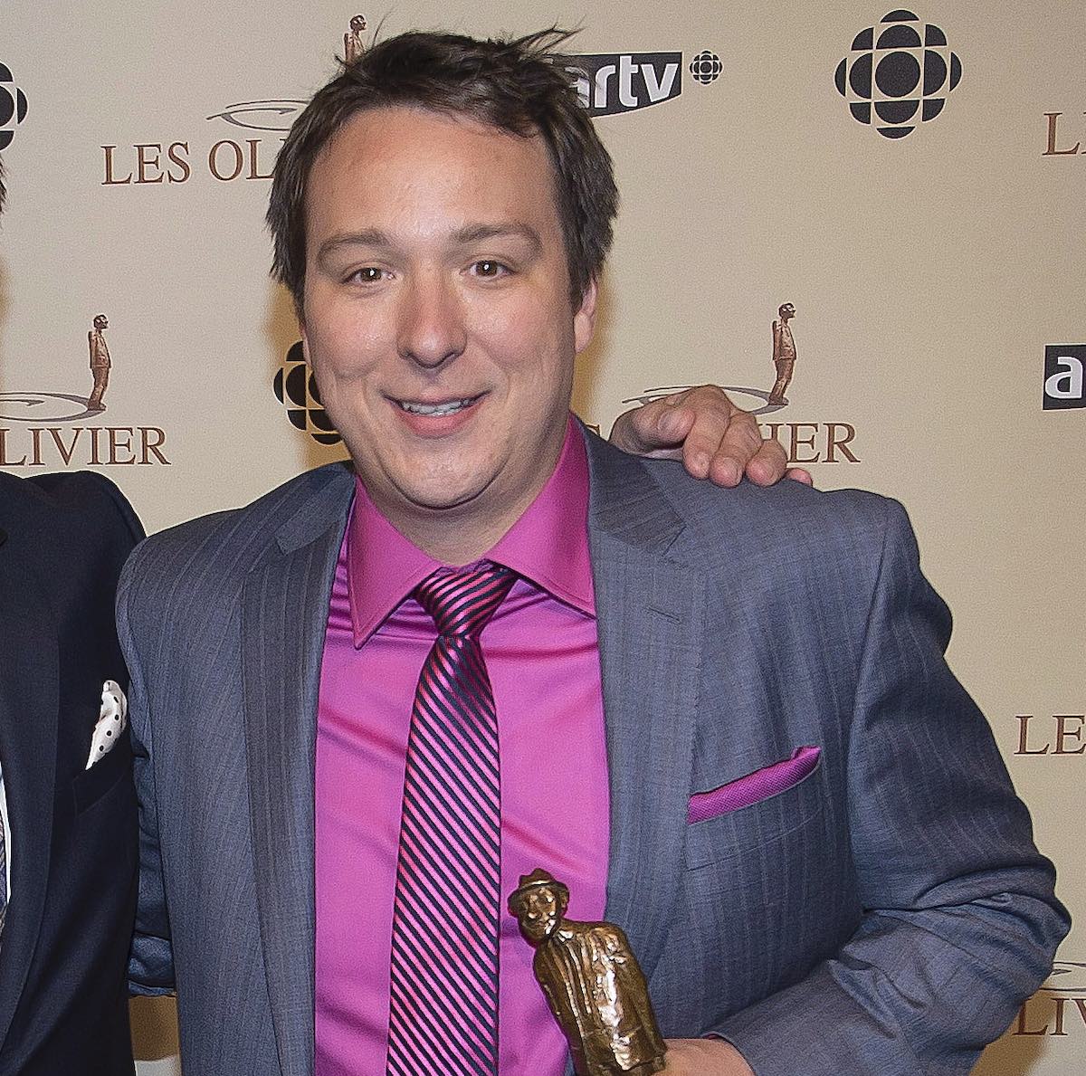 Gala des Olivier host Mario Jean, left, poses with Mise en scène catagory winner Pierre-Francois Legendre, right, at the annual Gala des Oliver in Montreal Sunday, May 12, 2013. THE CANADIAN PRESS/Peter McCabe