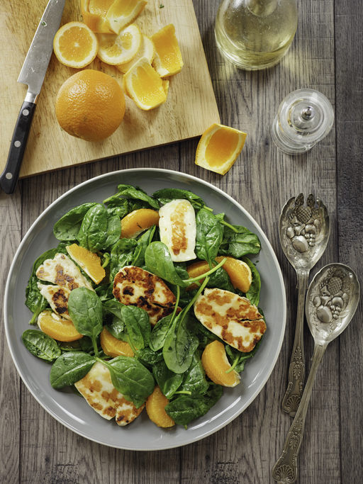 Home made Healthy spinach,orange salad with grilled halloumi cheese