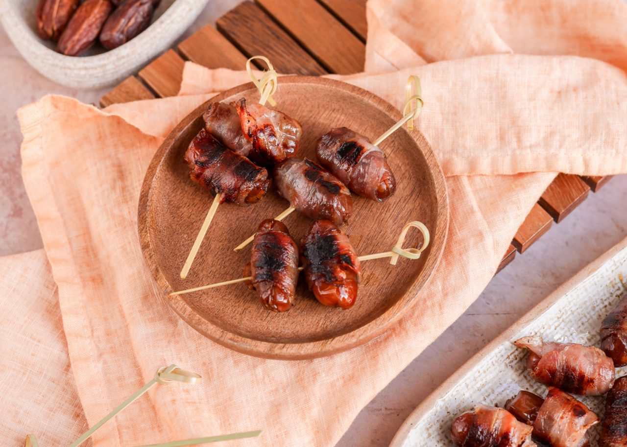 Dates wrapped in bacon snack meze Appetizer  tapas