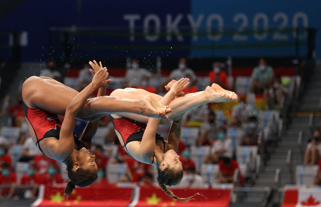 TOKYO, JAPAN - JULY 25: Jennifer Abel and Melissa Citrini Beaulieu of Canada compete in the Women's Synchronised 3m Springboard on day two of the Tokyo 2020 Olympic Games at Tokyo Aquatics Centre on July 25, 2021 in Tokyo, Japan. (Photo by Ian MacNicol/Getty Images)