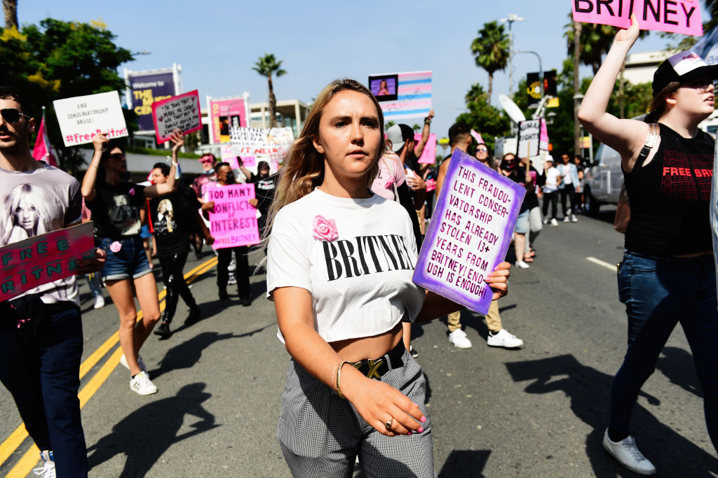 LOS ANGELES, CALIFORNIA - SEPTEMBER 29: #FreeBritney activists protest during a rally held in conjunction with a hearing on the future of Britney Spears' conservatorship at the Stanley Mosk Courthouse on September 29, 2021 in Los Angeles, California. Spears was placed in a conservatorship managed by her father, Jamie Spears, and an attorney, which controls her assets and business dealings, following her involuntary hospitalization for mental care in 2008. Spears and her father have asked the court to remove him from his role in the conservatorship. (Photo by Chelsea Guglielmino/Getty Images)
