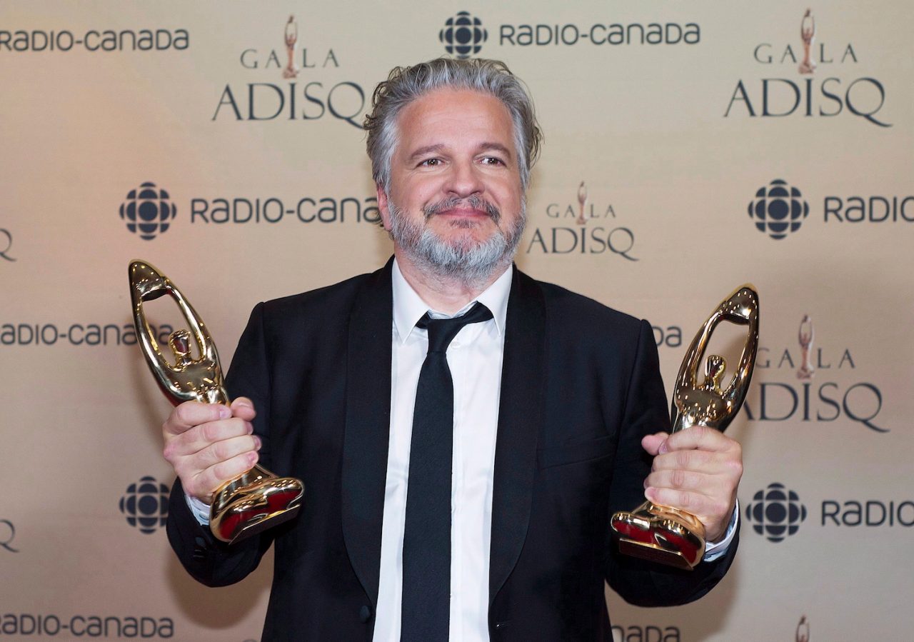Daniel Belanger holds up his trophies at the gala Adisq awards ceremony in Montreal, Sunday, October 29, 2017. THE CANADIAN PRESS/Graham Hughes