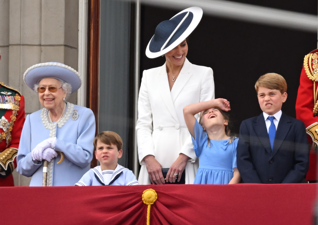 LONDON, ENGLAND - JUNE 02: (L-R) Queen Elizabeth II, Prince Louis, Catherine, Duchess of Cambridge, Princess Charlotte and Prince George during Trooping the Colour on June 02, 2022 in London, England. The Platinum Jubilee of Elizabeth II is being celebrated from June 2 to June 5, 2022, in the UK and Commonwealth to mark the 70th anniversary of the accession of Queen Elizabeth II on 6 February 1952. Trooping The Colour, also known as The Queen's Birthday Parade, is a military ceremony performed by regiments of the British Army that has taken place since the mid-17th century. It marks the official birthday of the British Sovereign. This year, from June 2 to June 5, 2022, there is the added celebration of the Platinum Jubilee of Elizabeth II  in the UK and Commonwealth to mark the 70th anniversary of her accession to the throne on 6 February 1952. (Photo by Karwai Tang/WireImage)