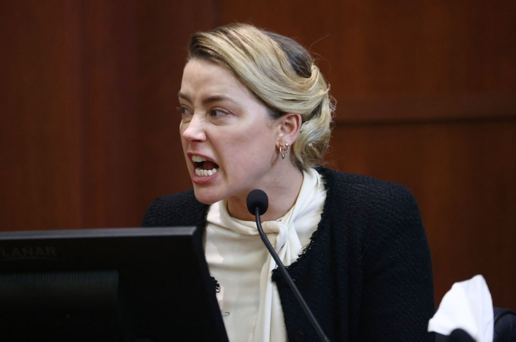TOPSHOT - US actress Amber Heard testifies at the Fairfax County Circuit Courthouse in Fairfax, Virginia, on May 5, 2022. - Actor Johnny Depp is suing ex-wife Amber Heard for libel after she wrote an op-ed piece in The Washington Post in 2018 referring to herself as a public figure representing domestic abuse. (Photo by Jim LO SCALZO / POOL / AFP) (Photo by JIM LO SCALZO/POOL/AFP via Getty Images)