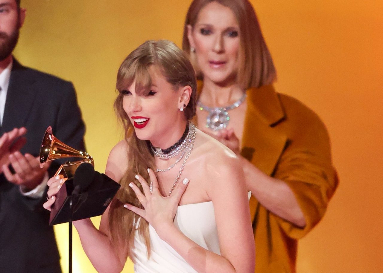 Taylor Swift accepts the Album Of The Year award for "Midnights" on stage with Celine Dion at the 66th Annual GRAMMY Awards held at Crypto.com Arena on February 4, 2024 in Los Angeles, California. (Photo by Christopher Polk/Billboard via Getty Images)