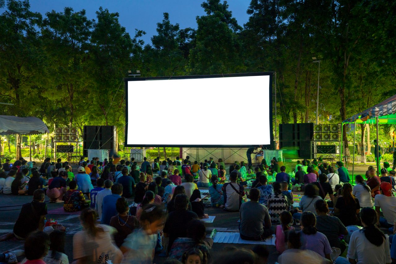 Spectators at Open-Air cinema summer night