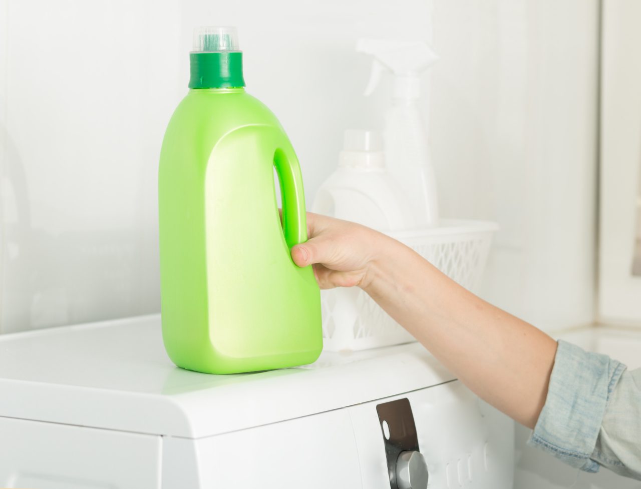 Bottle of detergent on a washing machine