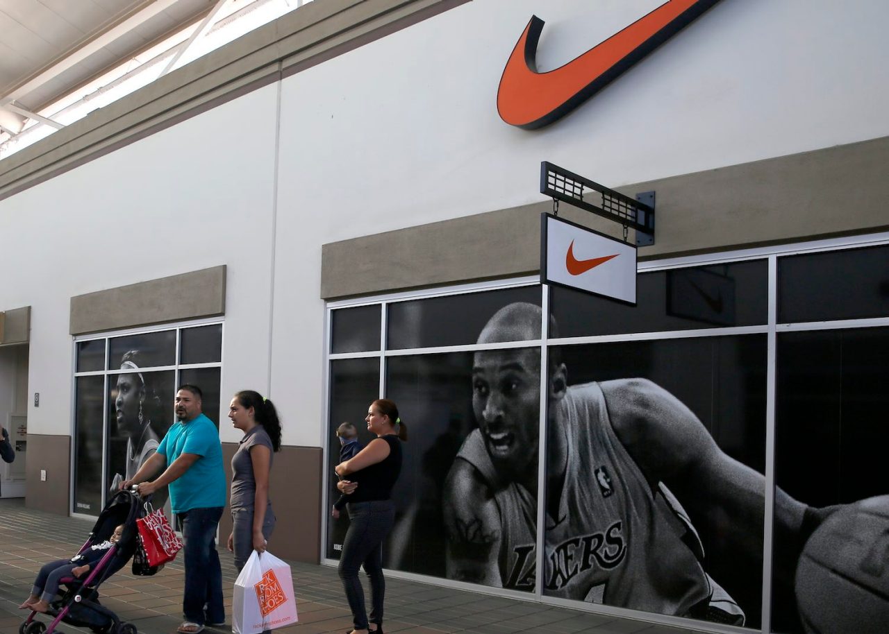 View of shoppers passing the Nike store at San Francisco Premium Outlets on Wednesday, September 14, 2016, in Livermore, Calif.