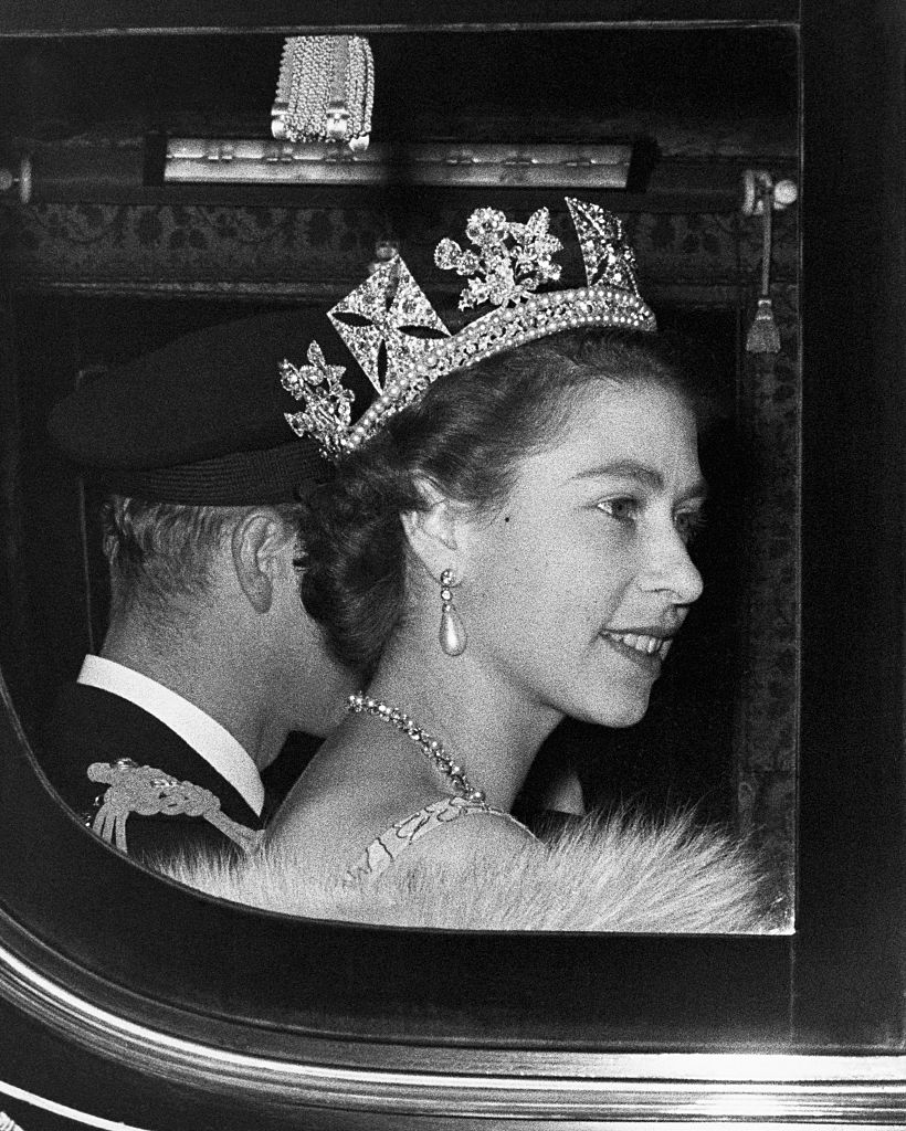 The Queen and the Duke of Edinburgh leave Buckingham Palace on their way to the Houses of Parliament for the Queen to perform the first State Opening Ceremony of her reign. (Photo by Â© Hulton-Deutsch Collection/CORBIS/Corbis via Getty Images)