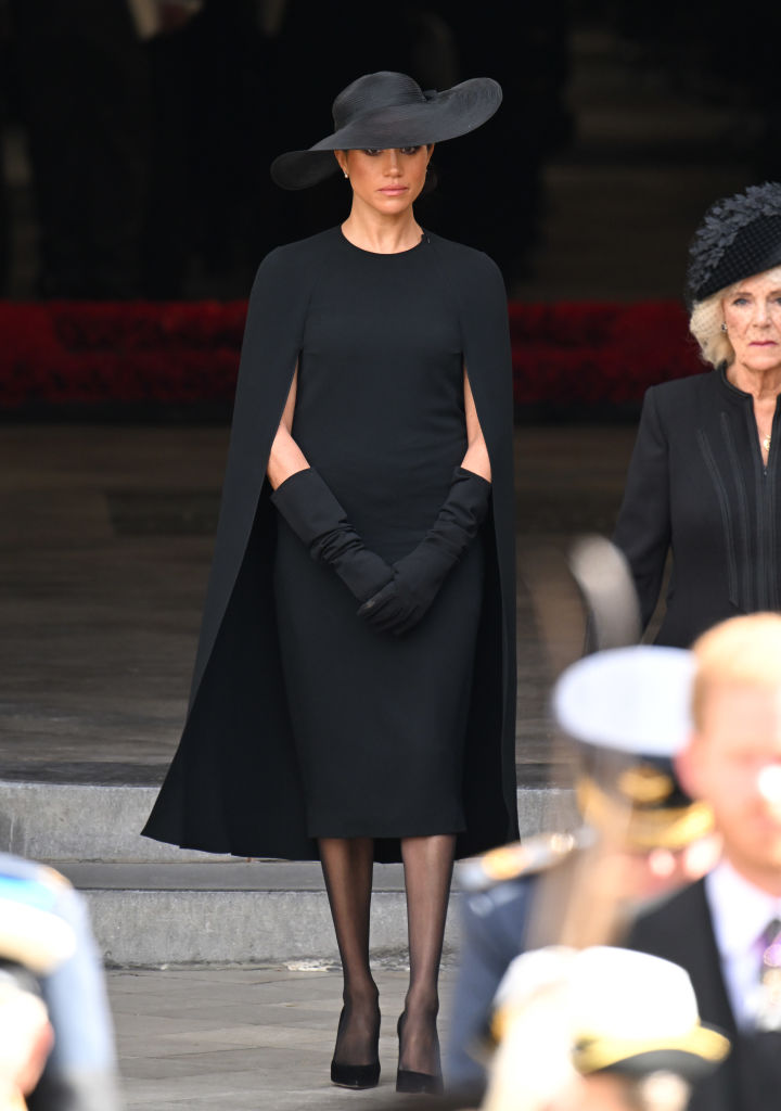LONDON, ENGLAND - SEPTEMBER 19: Meghan, Duchess of Sussex during the State Funeral of Queen Elizabeth II at Westminster Abbey on September 19, 2022 in London, England. Elizabeth Alexandra Mary Windsor was born in Bruton Street, Mayfair, London on 21 April 1926. She married Prince Philip in 1947 and ascended the throne of the United Kingdom and Commonwealth on 6 February 1952 after the death of her Father, King George VI. Queen Elizabeth II died at Balmoral Castle in Scotland on September 8, 2022, and is succeeded by her eldest son, King Charles III. (Photo by Karwai Tang/WireImage)
