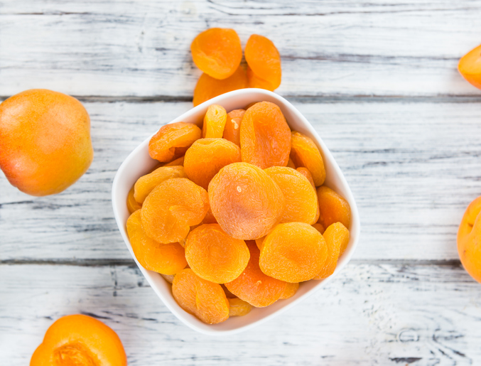 Portion of fresh Dried Apricots (close-up shot; selective focus)